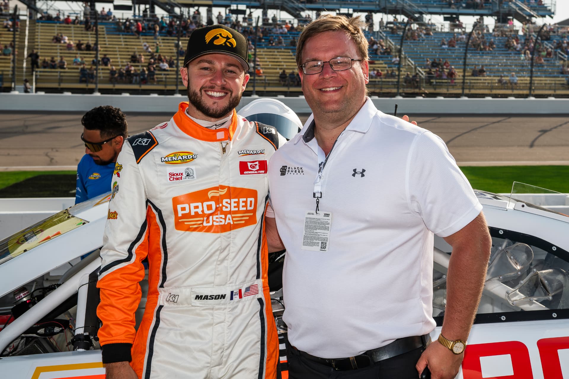 Tim Clagg on pit road with an ARCA Menards Series driver beside his race car