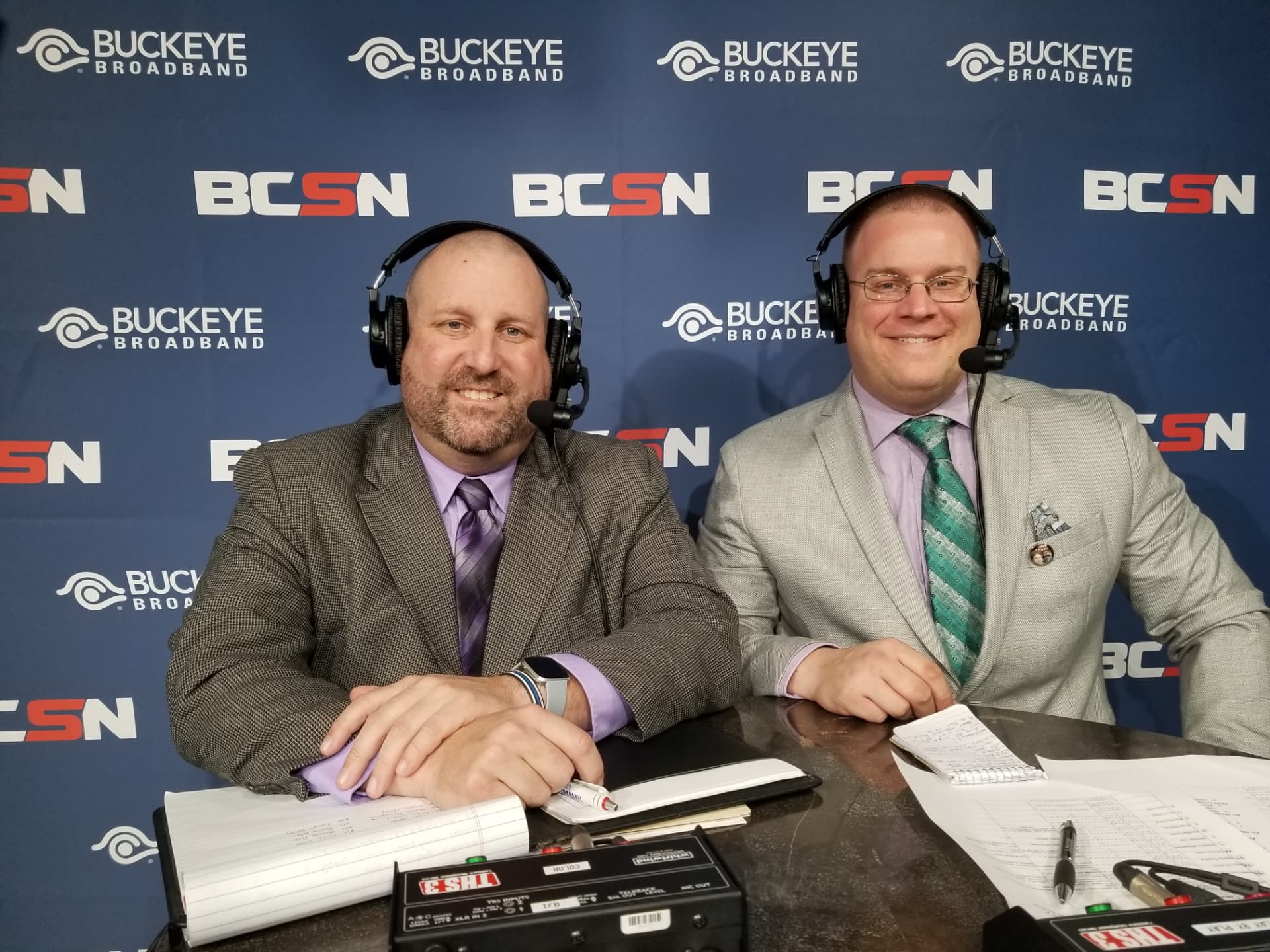 Tim Clagg and his broadcast partner in headsets at the BCSN broadcast table